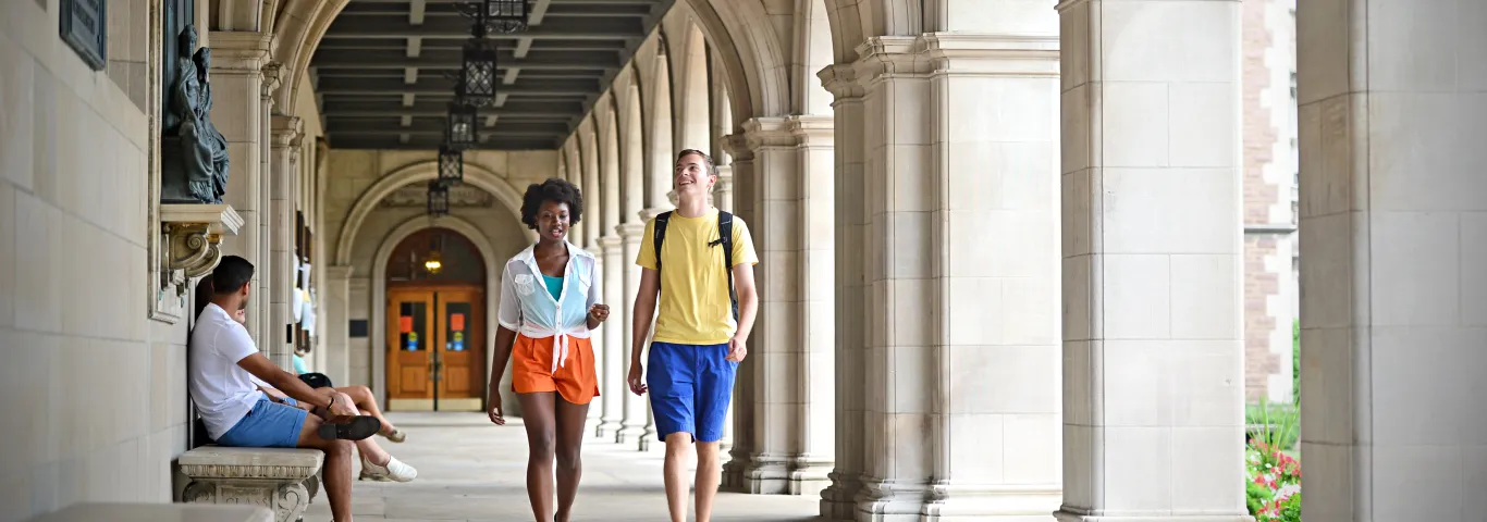 Students walking by Ridgley Hall on WashU campus