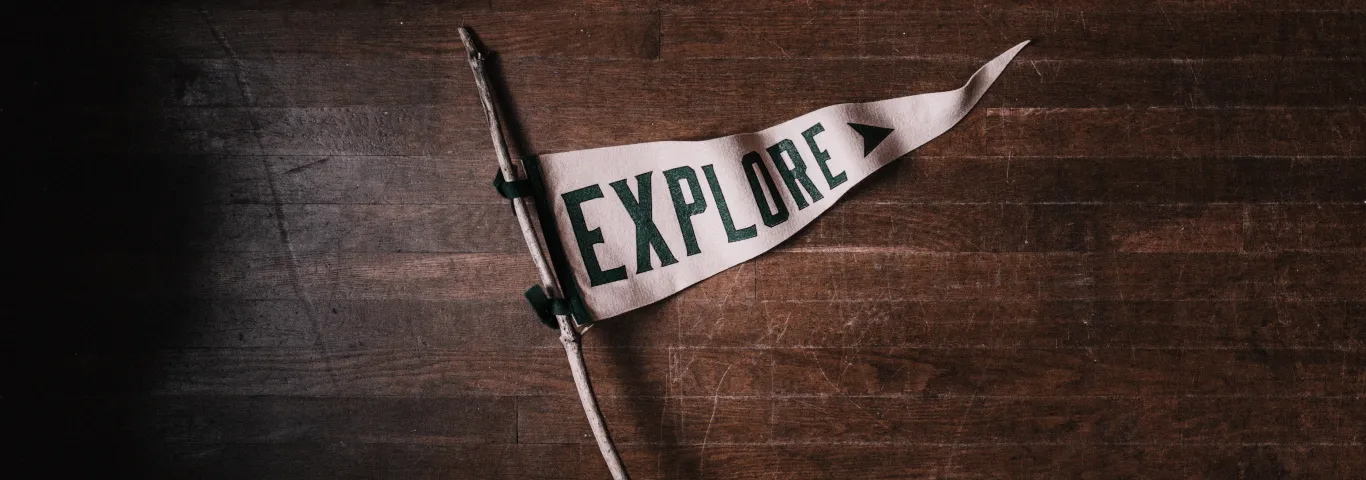 white flag with the word explore written in bold dark letters
